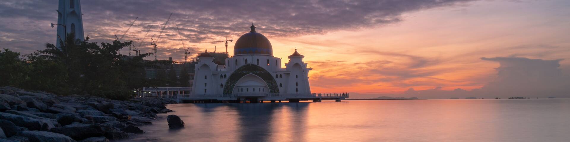 beautiful sunrise at malacca straits mosque