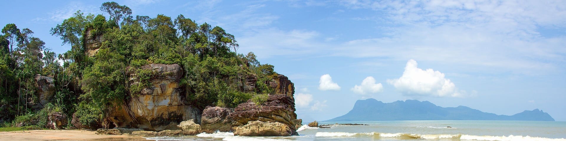 Sandy beach (Telok Paku) with rocks in Bako National Park, Borneo, Sarawak, Malaysia