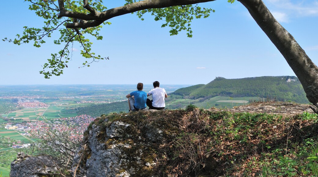 Lookout point on Bruken Rock in Swabian Jura in the German Federal State Baden-Württemberg. In the background is seen Owen and the castle Teck.