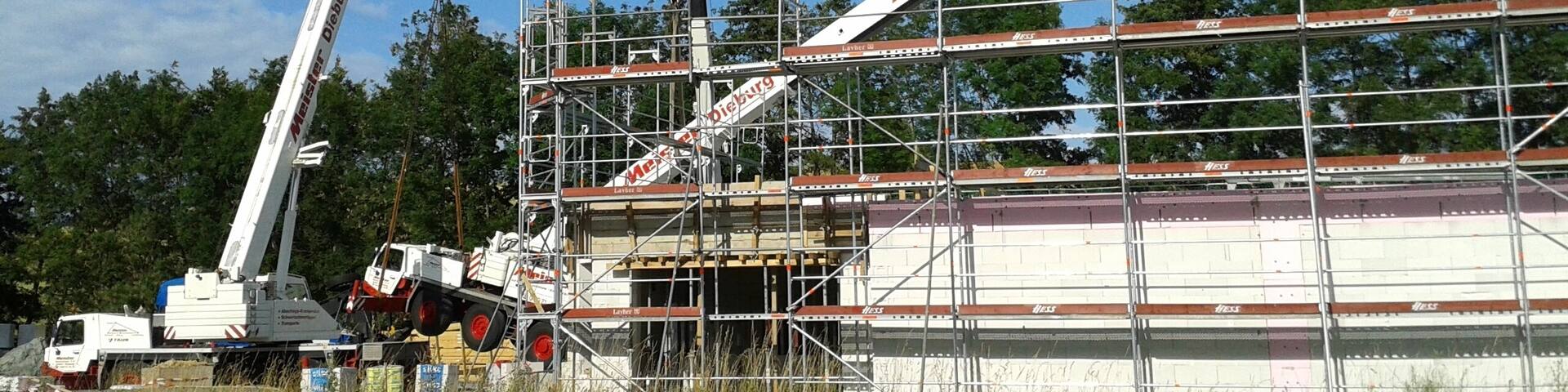 A truck-mounted crane crashes on the construction site of a supermarket in Modau, Ober-Ramstadt, Germany.