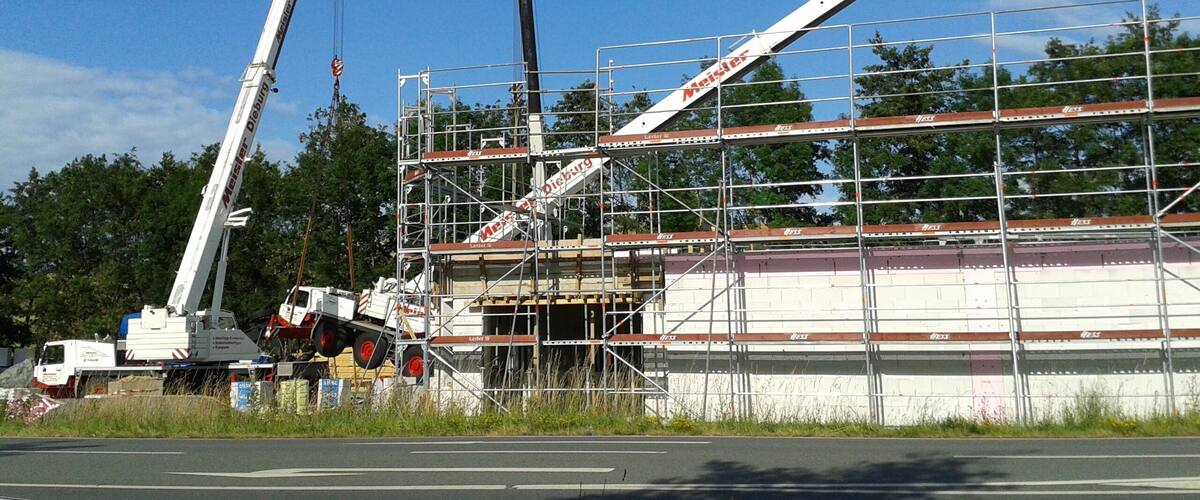 A construction site with a crane and scaffolding.