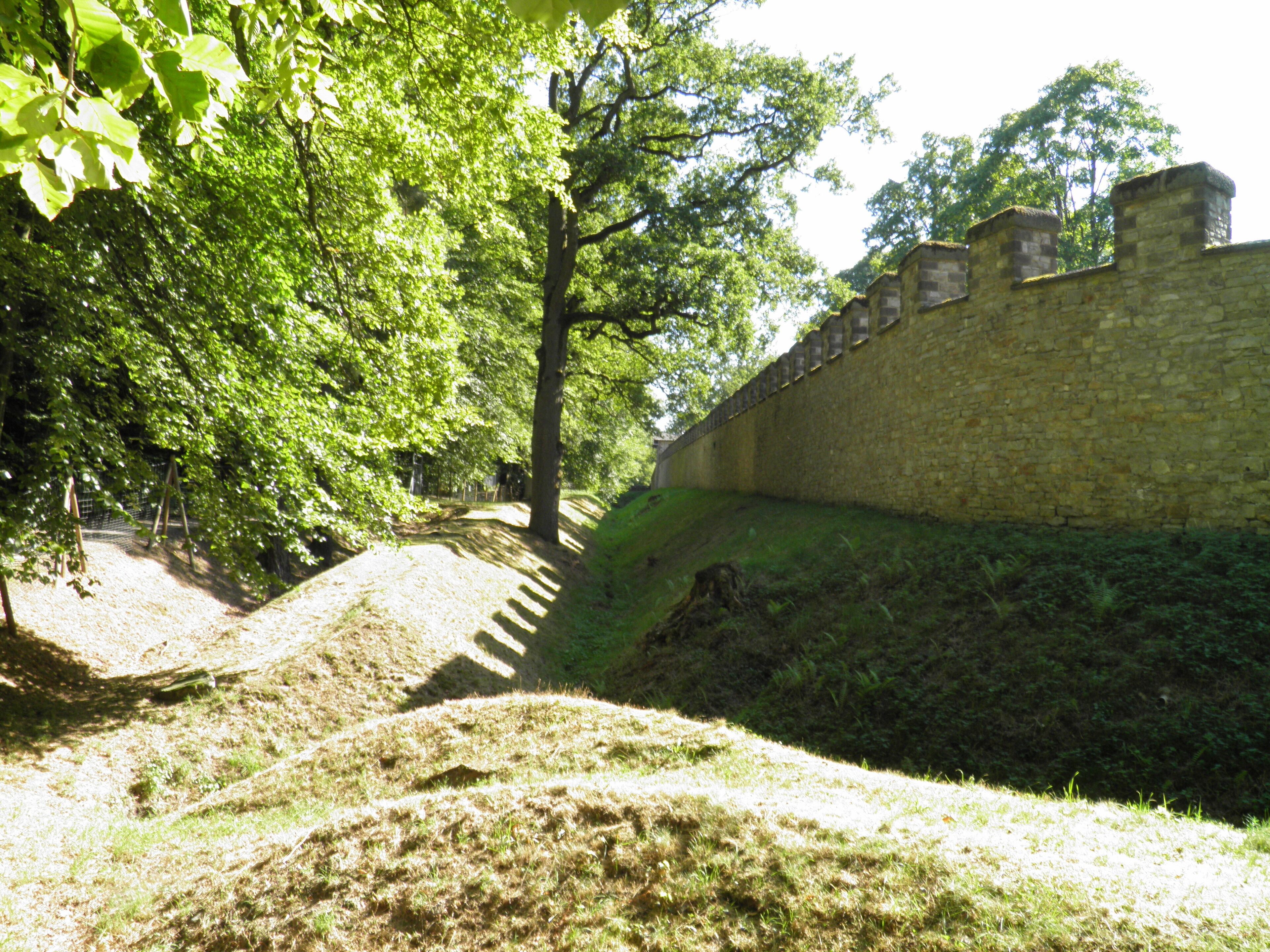 The reconstructed defences of the fort with the two ditches on the outside, Saalburg Roman Fort, Limes Germanicus, Germania (Germany)