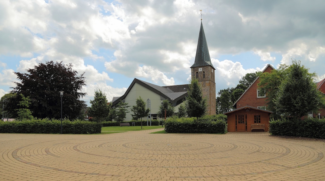 So called „Ecumenism Midst“ (Ökumenische Mitte) in Baccum, a city district of Lingen (Ems), Landkreis Emsland, Lower Saxony, Germany. The square is situated between the Reformed Church and the Roman Catholic St. Antonius Church.