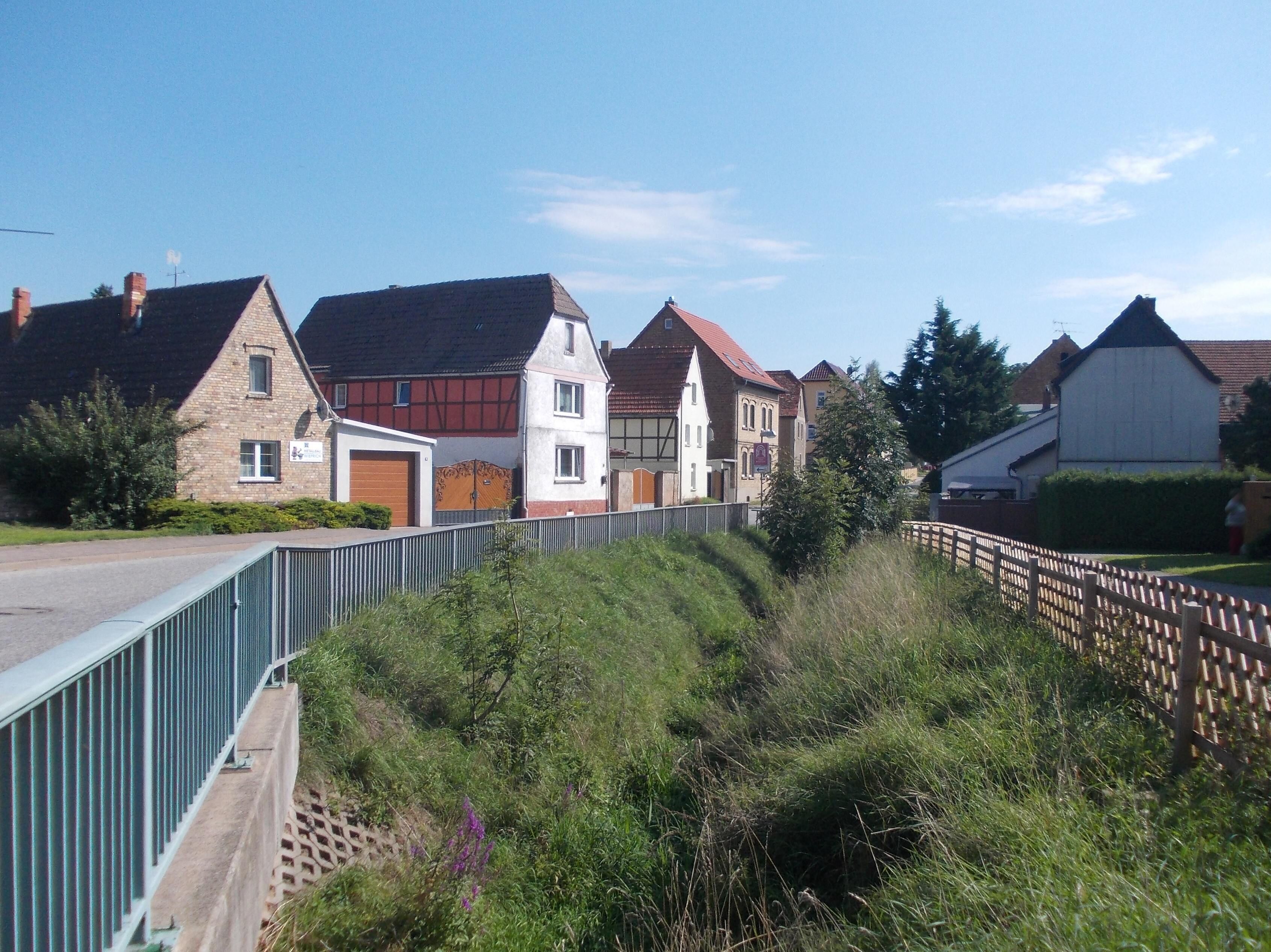 Magdeburger Strasse in Riestedt (Sangerhausen, Mansfeld-Südharz district, Saxony-Anhalt) with Riestedt stream