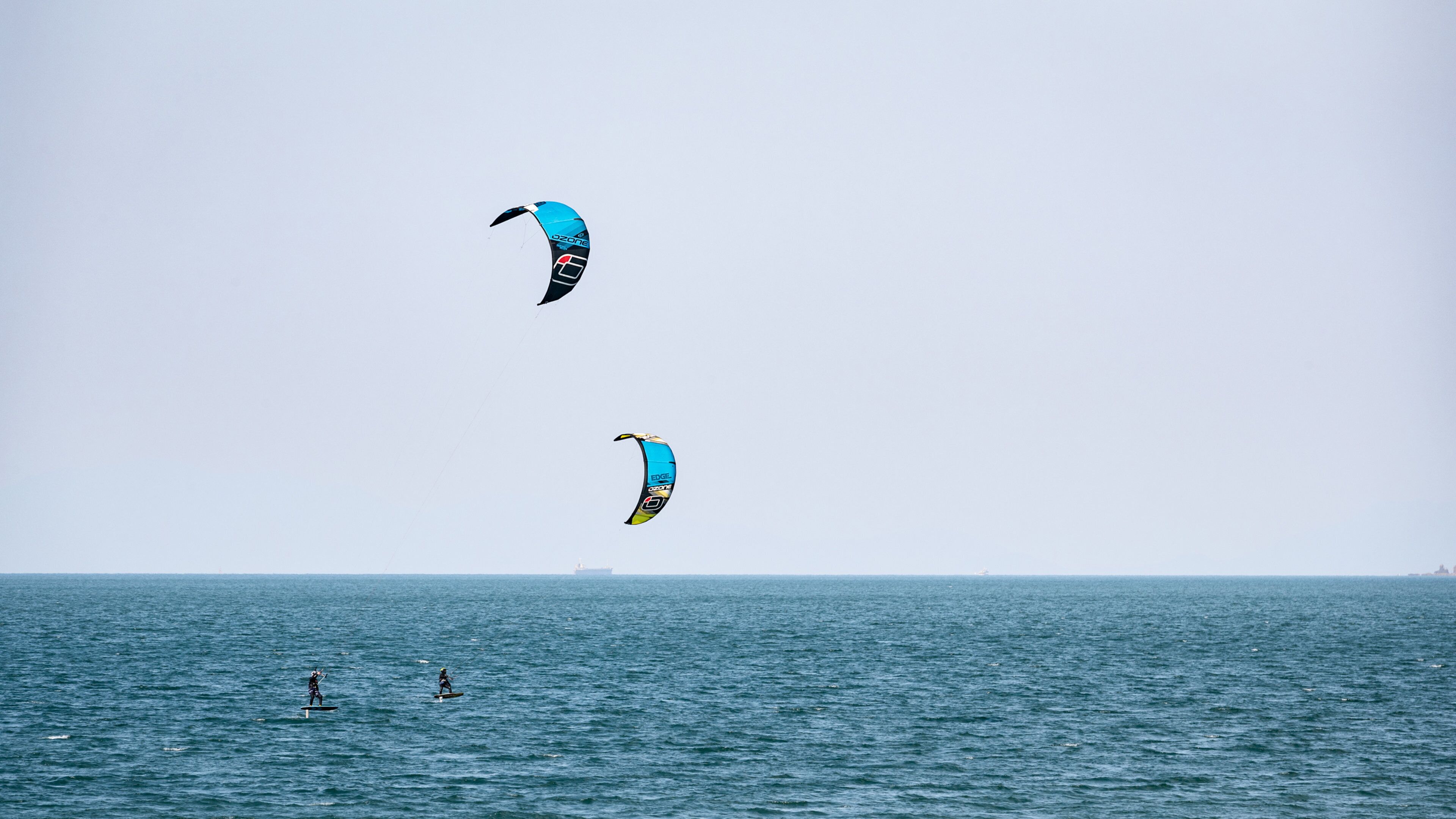 Horie which includes general coastal views and kite surfing