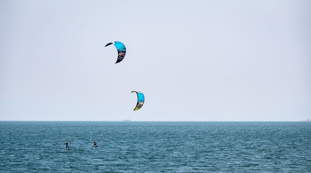 Horie which includes general coastal views and kite surfing