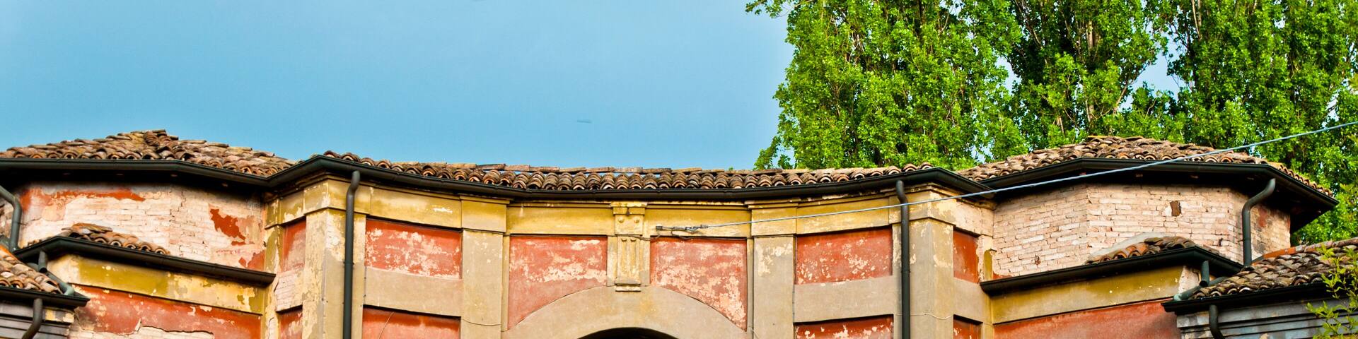 church framed in old ruined building in Sesso village, Italy