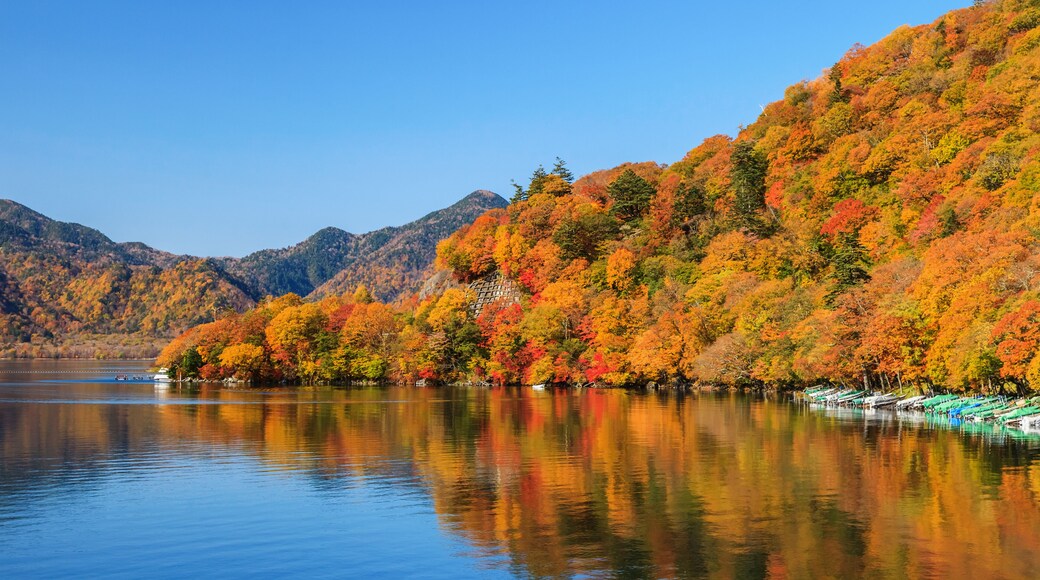 View of Chuzenji lake in autumn season with reflection water in Nikko, Japan