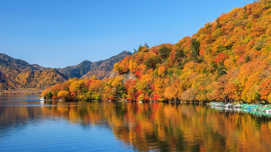 View of Chuzenji lake in autumn season with reflection water in Nikko, Japan