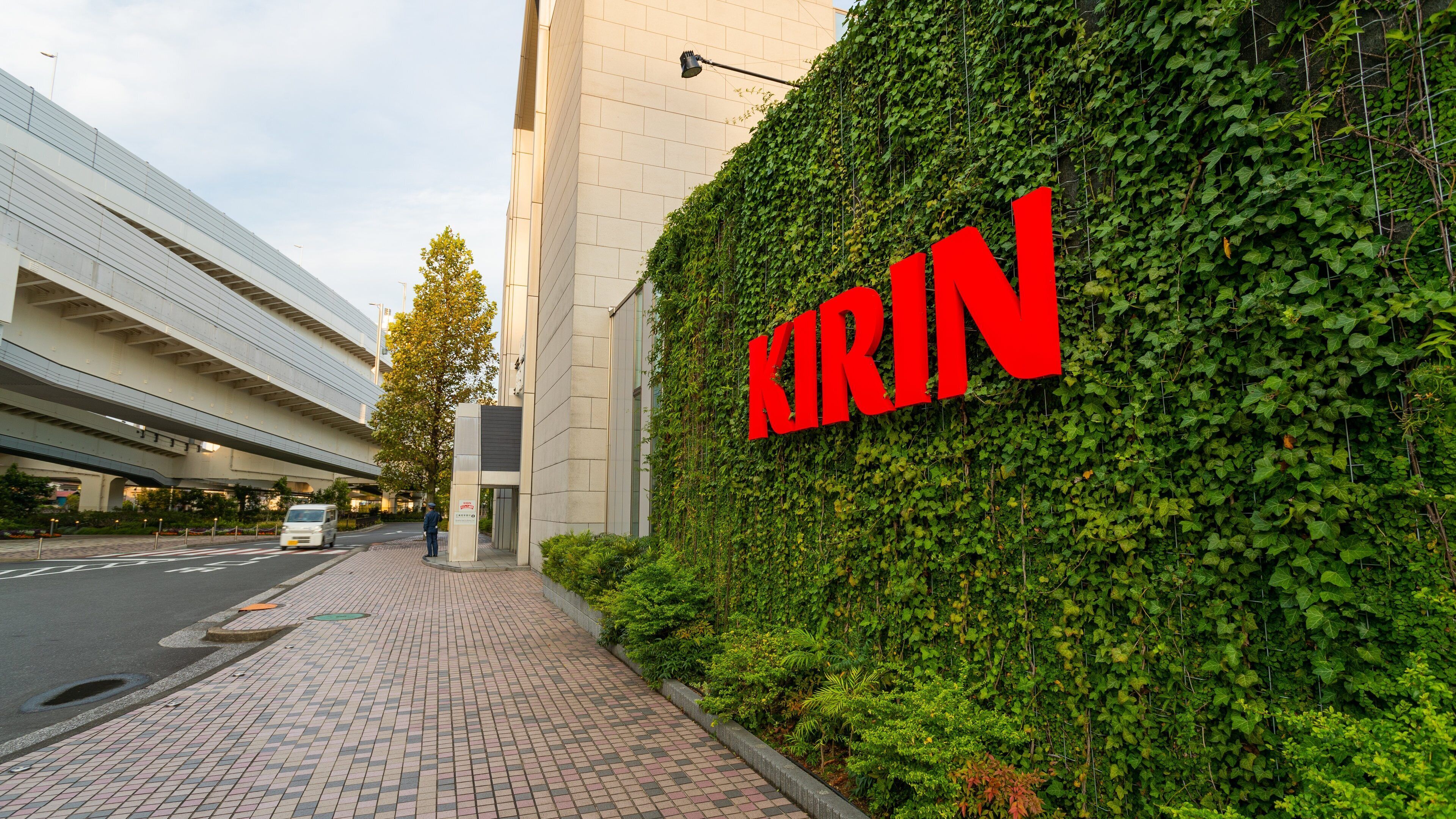 A building with a green ivy-covered wall and a large red sign reading "KIRIN".