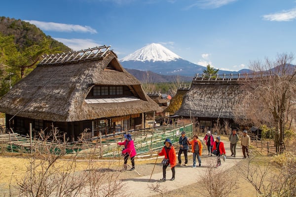Lake Saiko Iyashi no Sato NENBA featuring street scenes and a small town or village as well as a small group of people