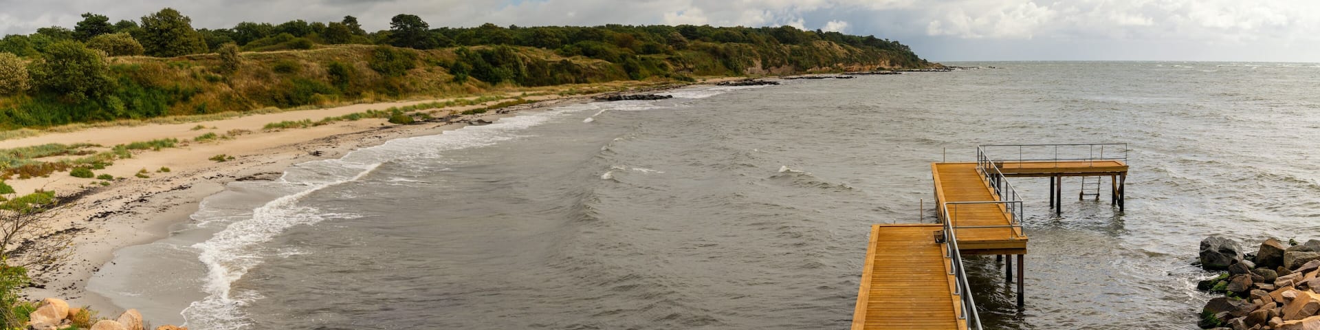view of the bathhouse pier and the Galokken beach near Ronne on the west coast of Bornholm Island