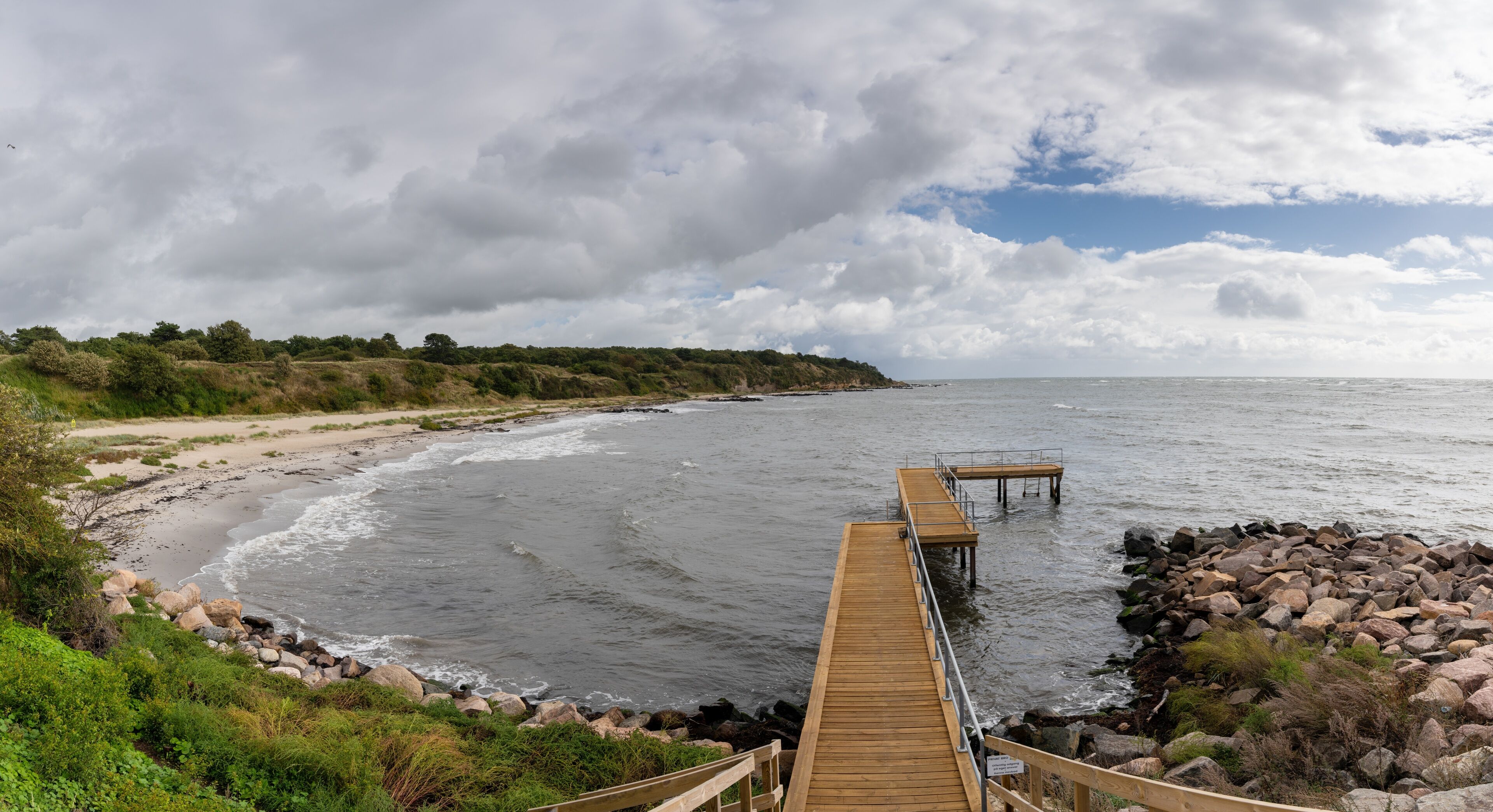 view of the bathhouse pier and the Galokken beach near Ronne on the west coast of Bornholm Island