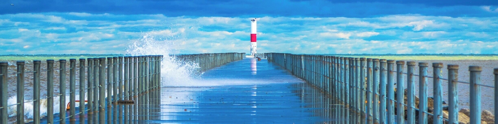 If u ever hike or walk near Ontario Beach park along the Rochester harbor ull see a lighthouse far away but be very careful because the wave from the ocean can hit u and get u wet.