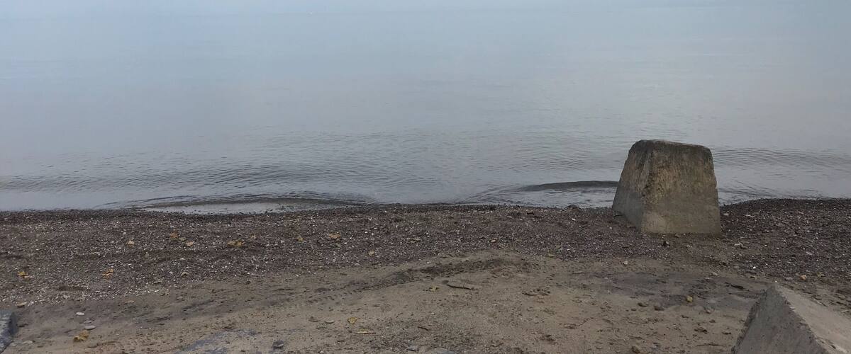Calm waters on a cloudy day on Lake Ontario.