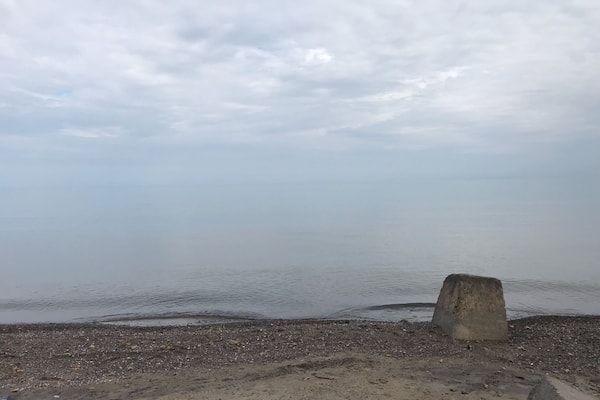 Calm waters on a cloudy day on Lake Ontario.