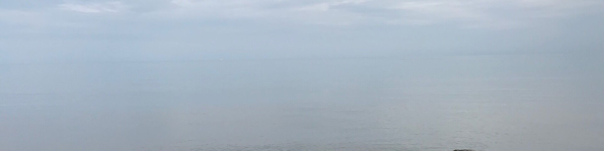 Calm waters on a cloudy day on Lake Ontario.