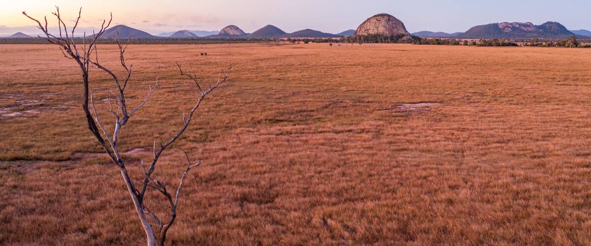 Capricorn Coast featuring tranquil scenes and a sunset