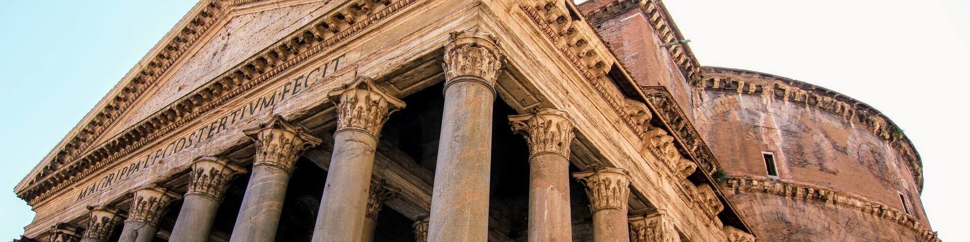 A classical building with columns and a large dome.