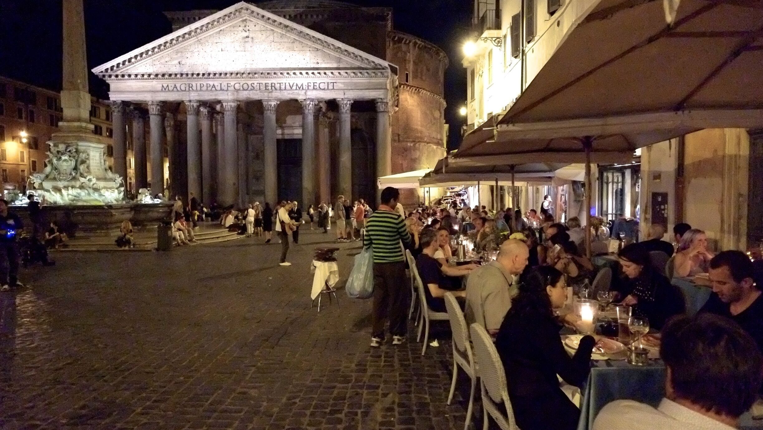 The Pantheon is a former Roman temple, now a church, in Rome, Italy, on the site of an earlier temple commissioned by Marcus Agrippa during the reign of Augustus (27 BC – 14 AD). The present building was completed by the emperor Hadrian and probably dedicated about 126 AD. He retained Agrippa's original inscription, which has caused confusion over its date of construction as the original Pantheon burned down, so it is not certain when the present one was built.