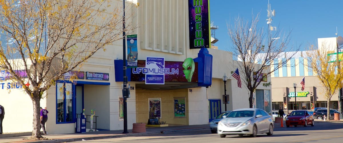 A building with a UFO Museum sign, a Subway restaurant, and a Main Entrance sign.