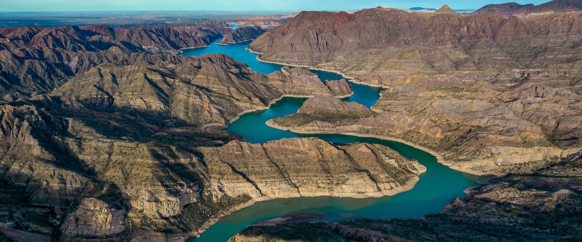 A river winding through a rugged canyon landscape.