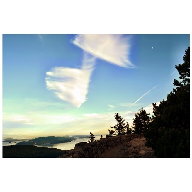 View on Mt Constitution, by far the best place to see the surrounding islands and land as far as Canada and Mt Rainier. Great place to visit. Didn't even notice the perfect music note the clouds made till I got home :)