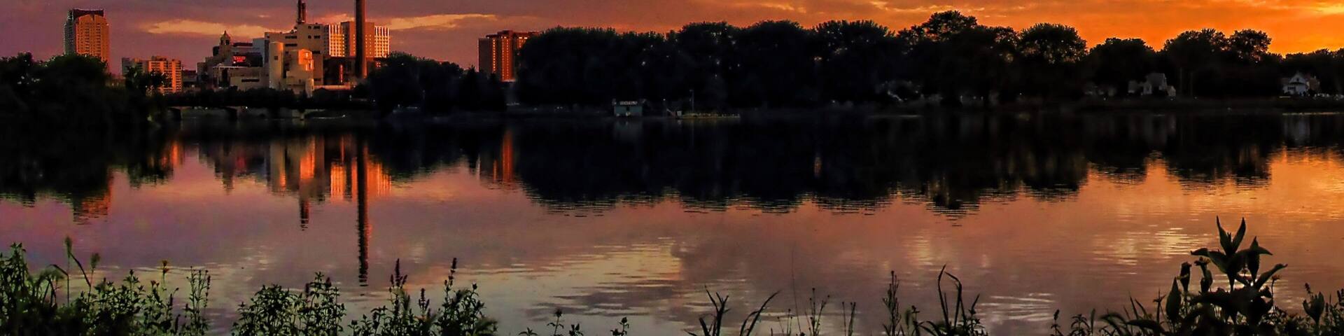 Rochester which includes landscape views, a sunset and a lake or waterhole