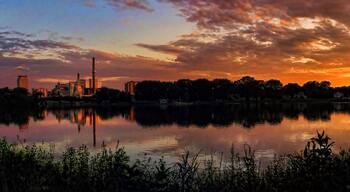 Rochester which includes landscape views, a sunset and a lake or waterhole