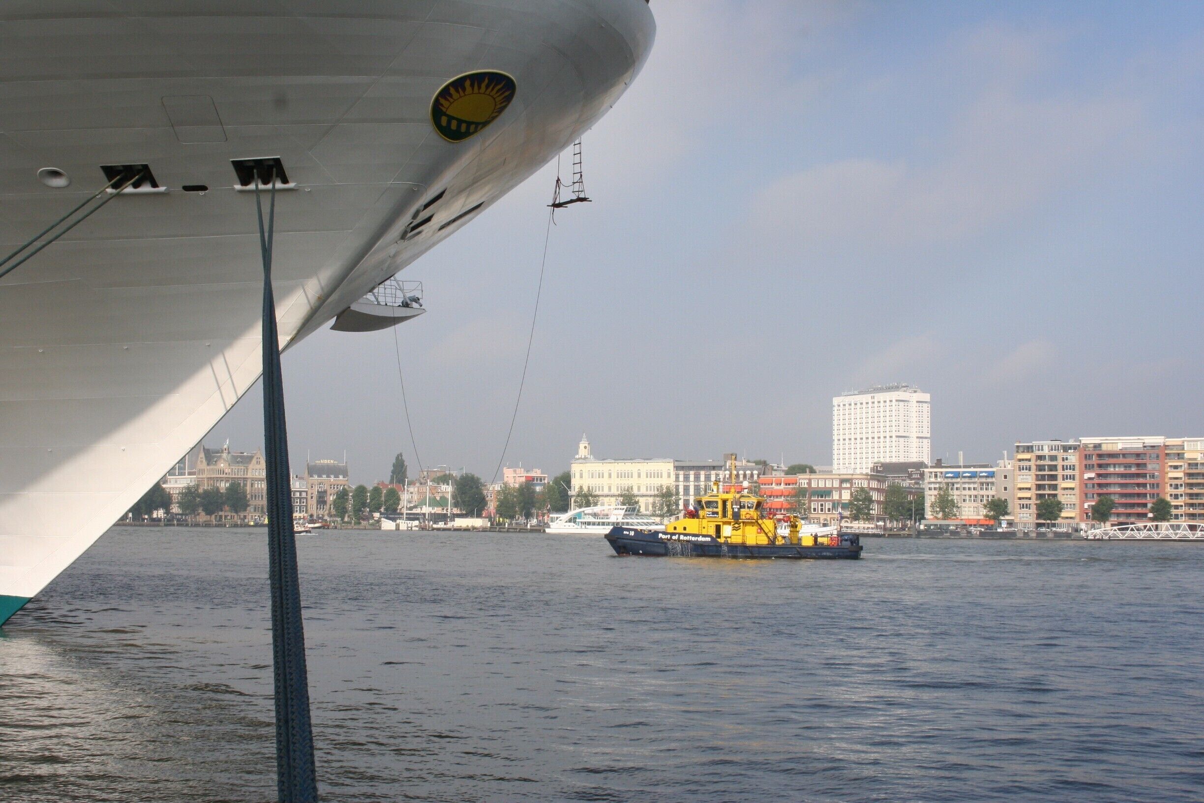 Cruise Terminal
The terminal is located right in the heart of downtown Rotterdam. The historic terminal is modernized, fully equipped and with an automatic, covered boarding bridge. The building itself houses a tourist information desk and during calls various stands offering time-honored Dutch handicrafts such as wooden shoe making and hindeloopen painting as well as antiques, souvenirs and much more.
http://www.cruiseportrotterdam.com/index.html

Tour Rotterdam with a Bus ?
Take a Splashbus !
http://www.splashtours.nl/en/
