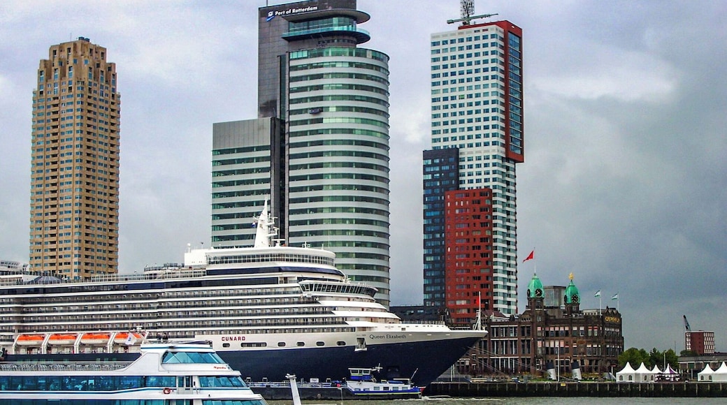 Busy Rotterdam waterways showing Cunard's Queen Elizabeth on her maiden visit.