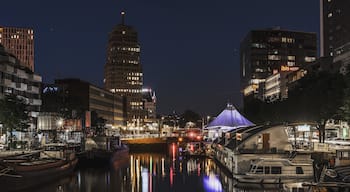 Rotterdam at night. With lots of beautifil buildings and boats.