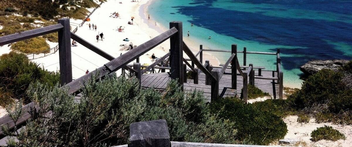Rottnest Island off the coast of WA, a short ferry ride from Perth. Great for a mini getaway with stunning white sand beaches and turquoise waters. The best part? It's home to the happiest animal on the planet, the Quokka!
