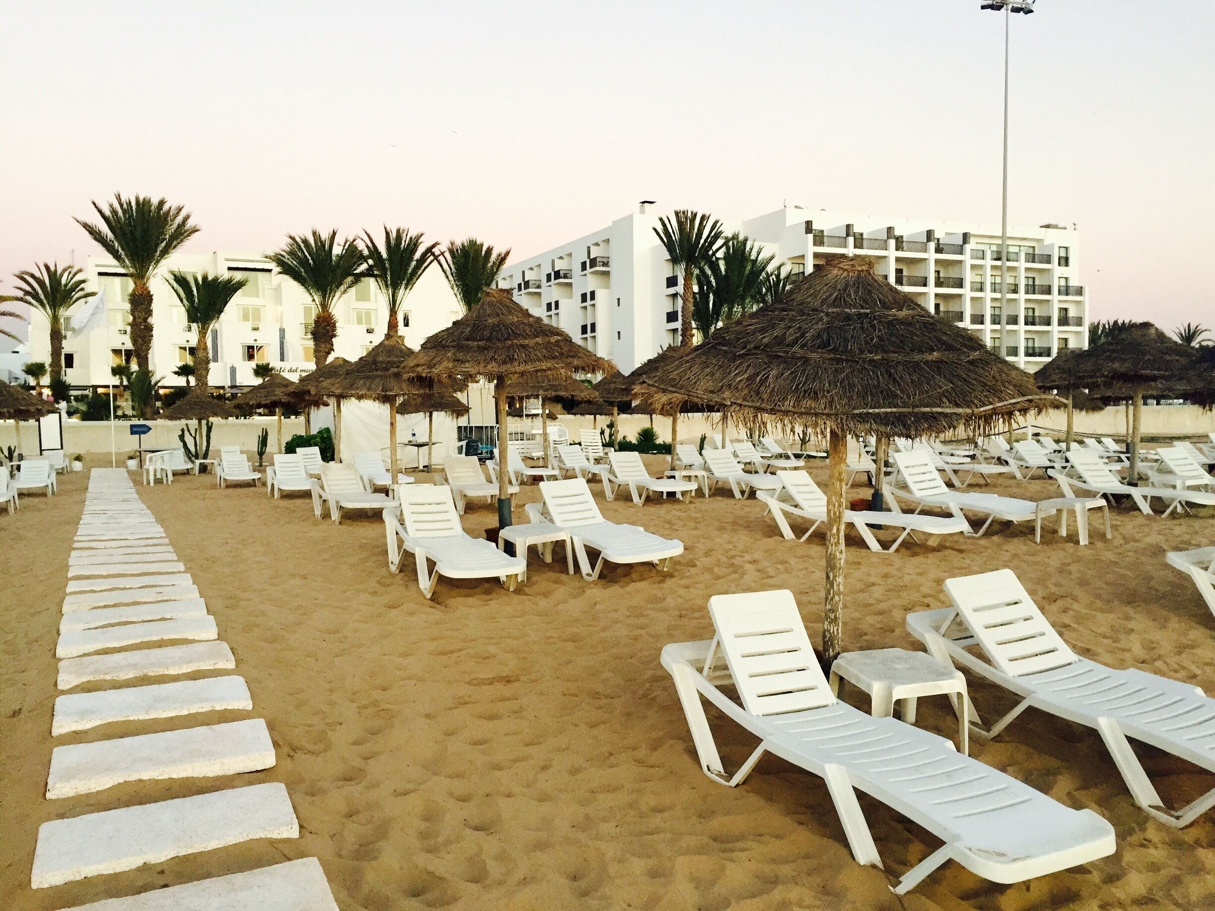 In the month of January it is great to stroll 🐪 beautiful beach of Agadir's  seashore but not warm enough for serious tanning. Do it by the pool of your hotel protected from the ocean's cool breeze  ... 😎 
#palmtrees, #sand, #vacation