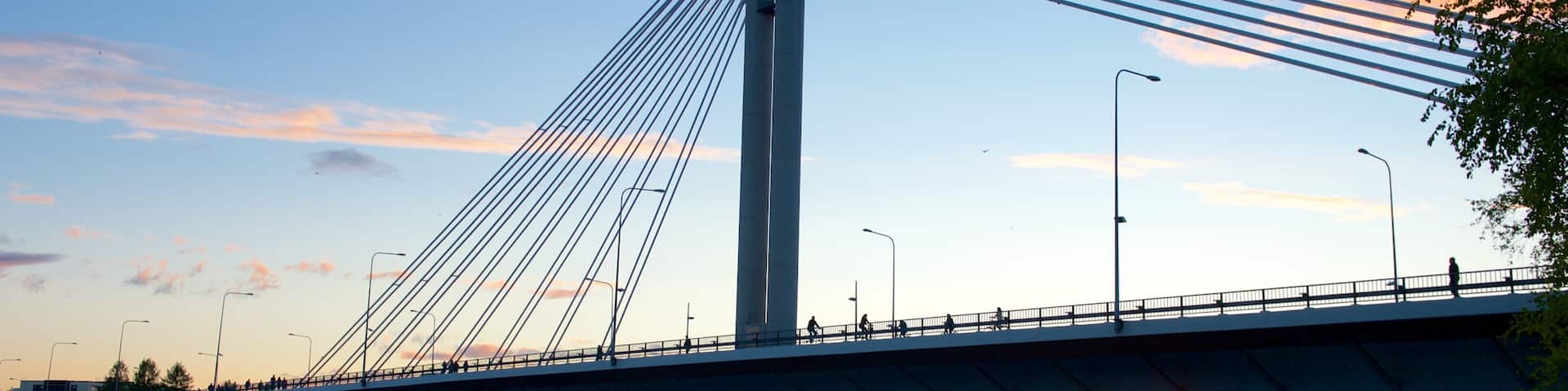 Rovaniemi which includes a sunset, a bridge and a river or creek