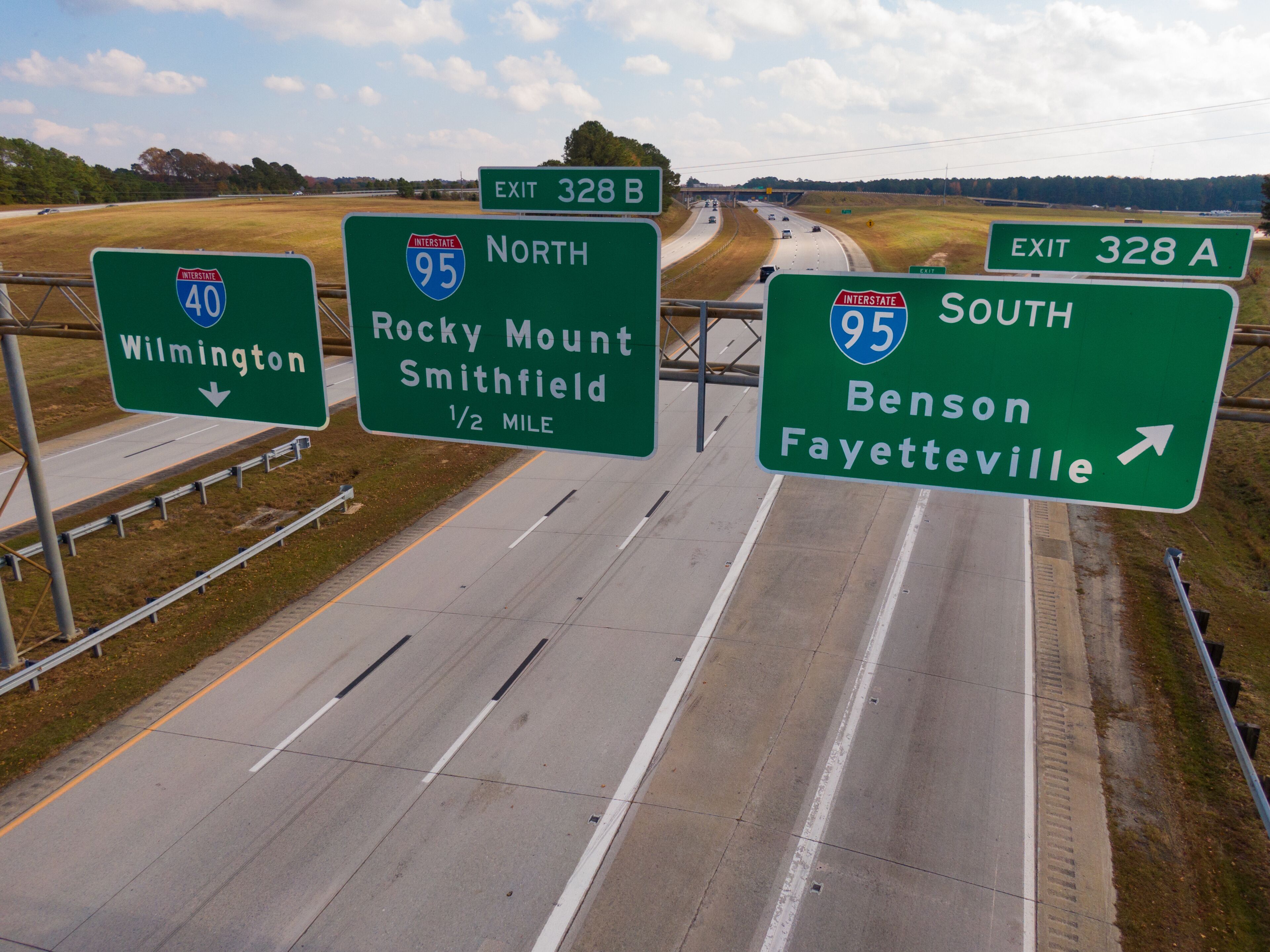 Highway signs indicating exits for Wilmington, Rocky Mount, Smithfield, Benson, and Fayetteville.