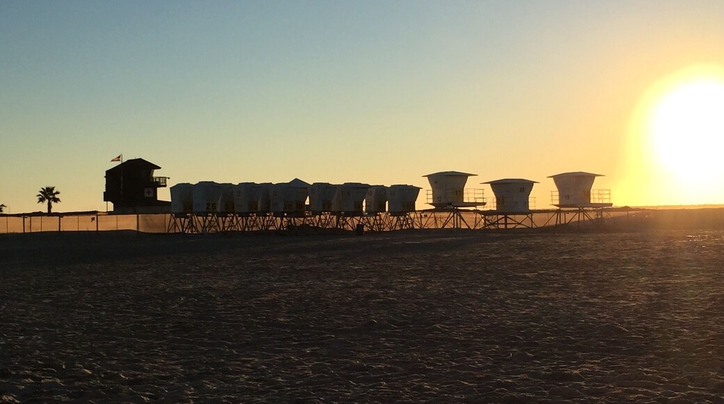 At southern end of the Boardwalk of South Mission Beach. Collection of lifeguard huts during the winter at Sunset. San Diego, CA.