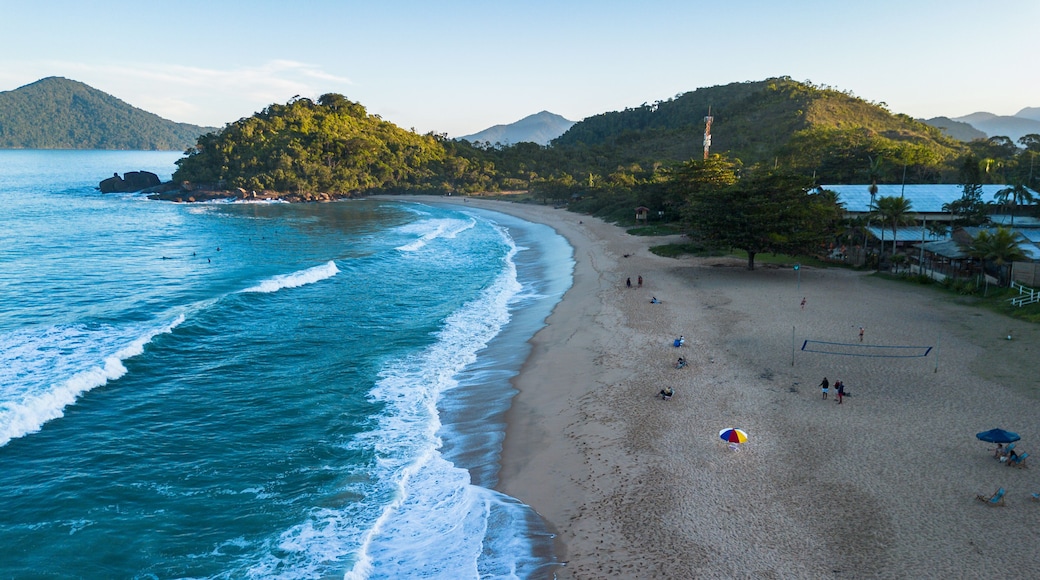 Drone photo of Praia Vermelha do Norte in Ubatuba, São Paulo, Brazil, with turquoise sea, clean sand and few people.
