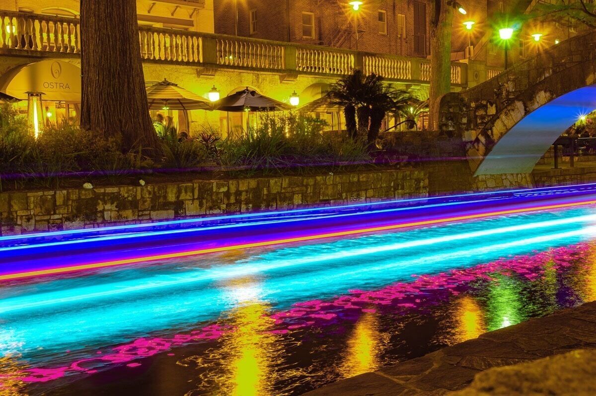Long Exposure Photography on the San Antonio River Walk. Sight seeing boats near the Selena Bridge.