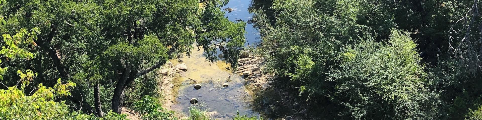 View from the cliffs above the dinosaur tracks in the river below in Government Canyon State Natural Area.
