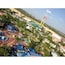 An amusement park with roller coasters, a Ferris wheel, and various rides.
