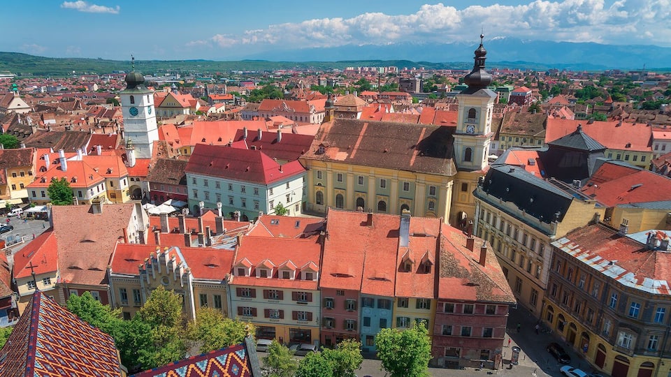 This is the view from the Cathedral in Sibiu. Slightly better than the view from Council Tower. There's also no glass obstructing the view.
http://www.alwayswanderlust.com/sibiu-romania-the-heart-of-transylvania/