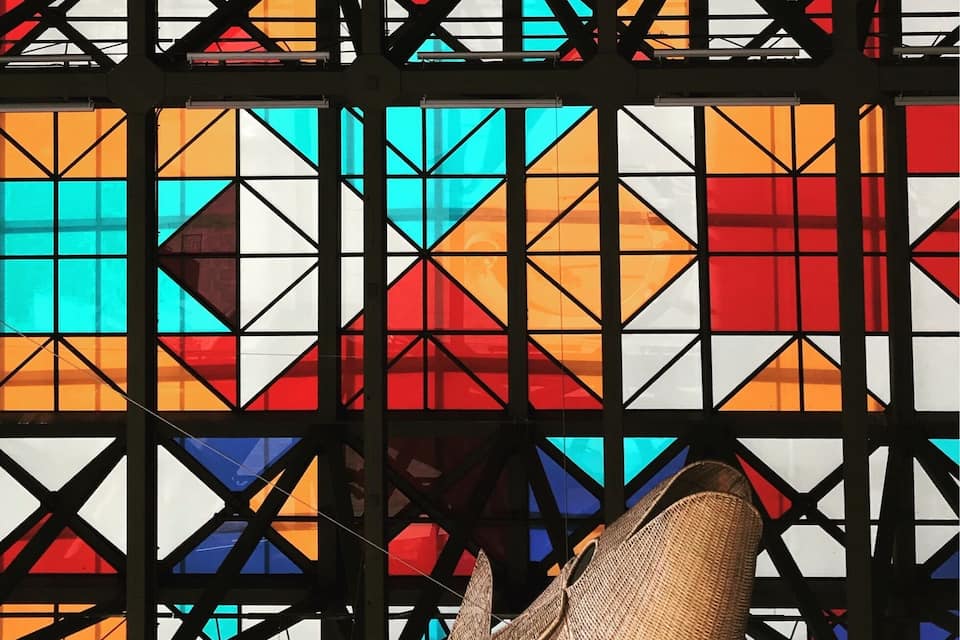 A colorful stained glass window with geometric patterns.