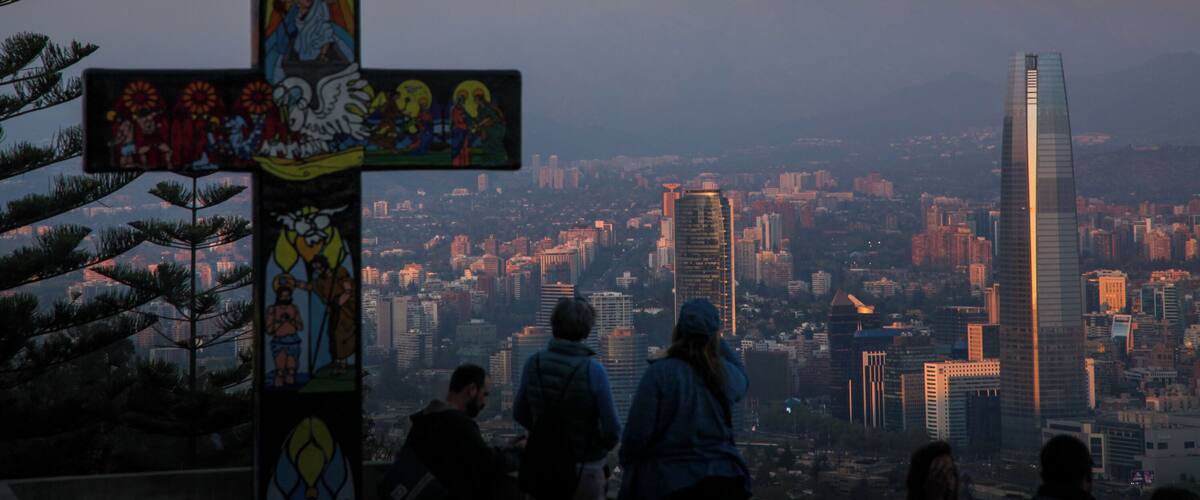 Take the cable car up San Cristóbal Hill at sunset. Santiago, Chile www.benhowe.net #southamerica #chile #cross #mountain #santigo #SanCristóbalHill