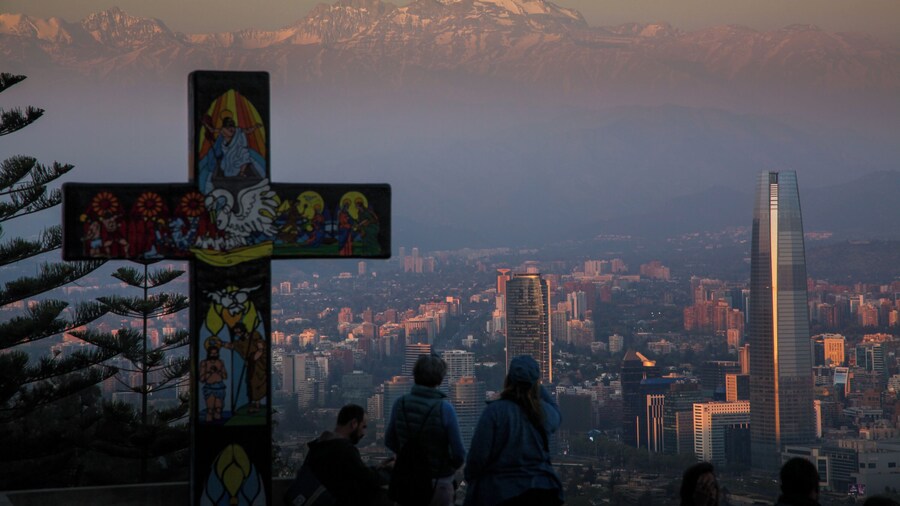 Take the cable car up San Cristóbal Hill at sunset. Santiago, Chile www.benhowe.net #southamerica #chile #cross #mountain #santigo #SanCristóbalHill