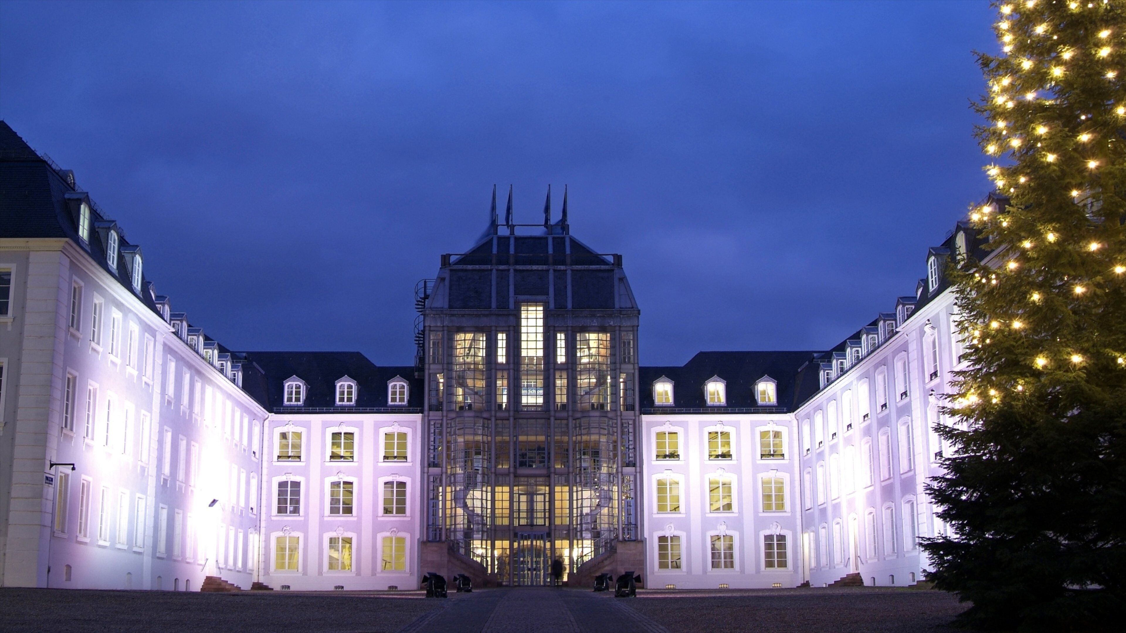 Saarbrücken which includes night scenes, a castle and heritage architecture