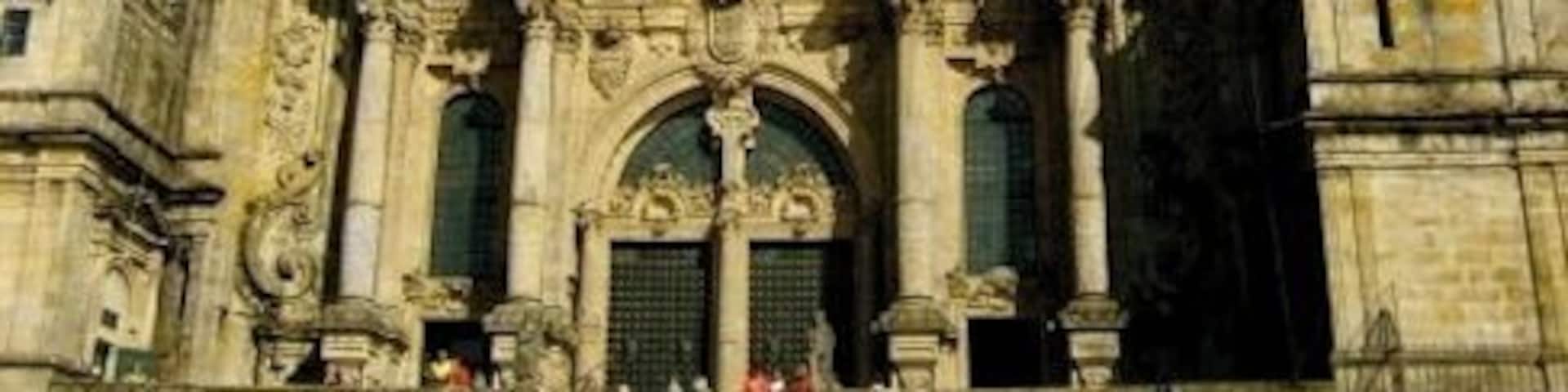 A historic cathedral with two prominent towers and intricate architectural details.