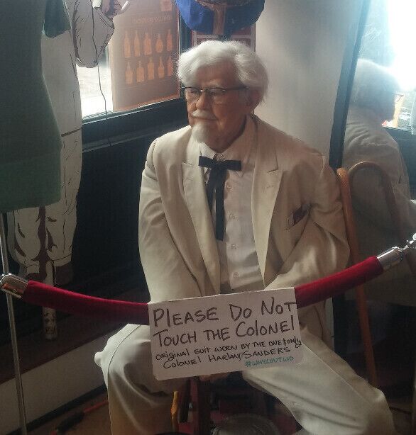 Colonel Harland David Sanders' wax doppelganger sporting an original white suit hanging out behind the velvet rope at WHY Lou Two. 