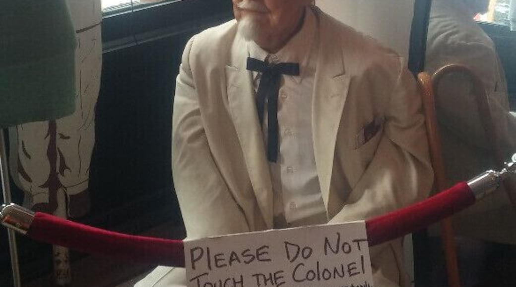 Colonel Harland David Sanders' wax doppelganger sporting an original white suit hanging out behind the velvet rope at WHY Lou Two.