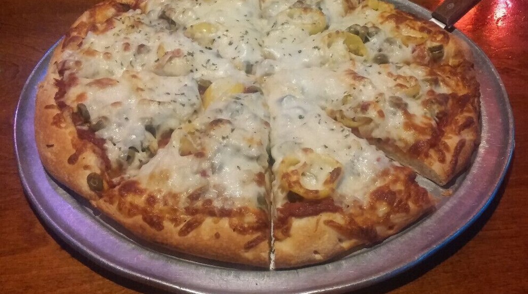 A pineapple, onion, banana pepper and green olive pizza from Wick's original location in The Highlands.